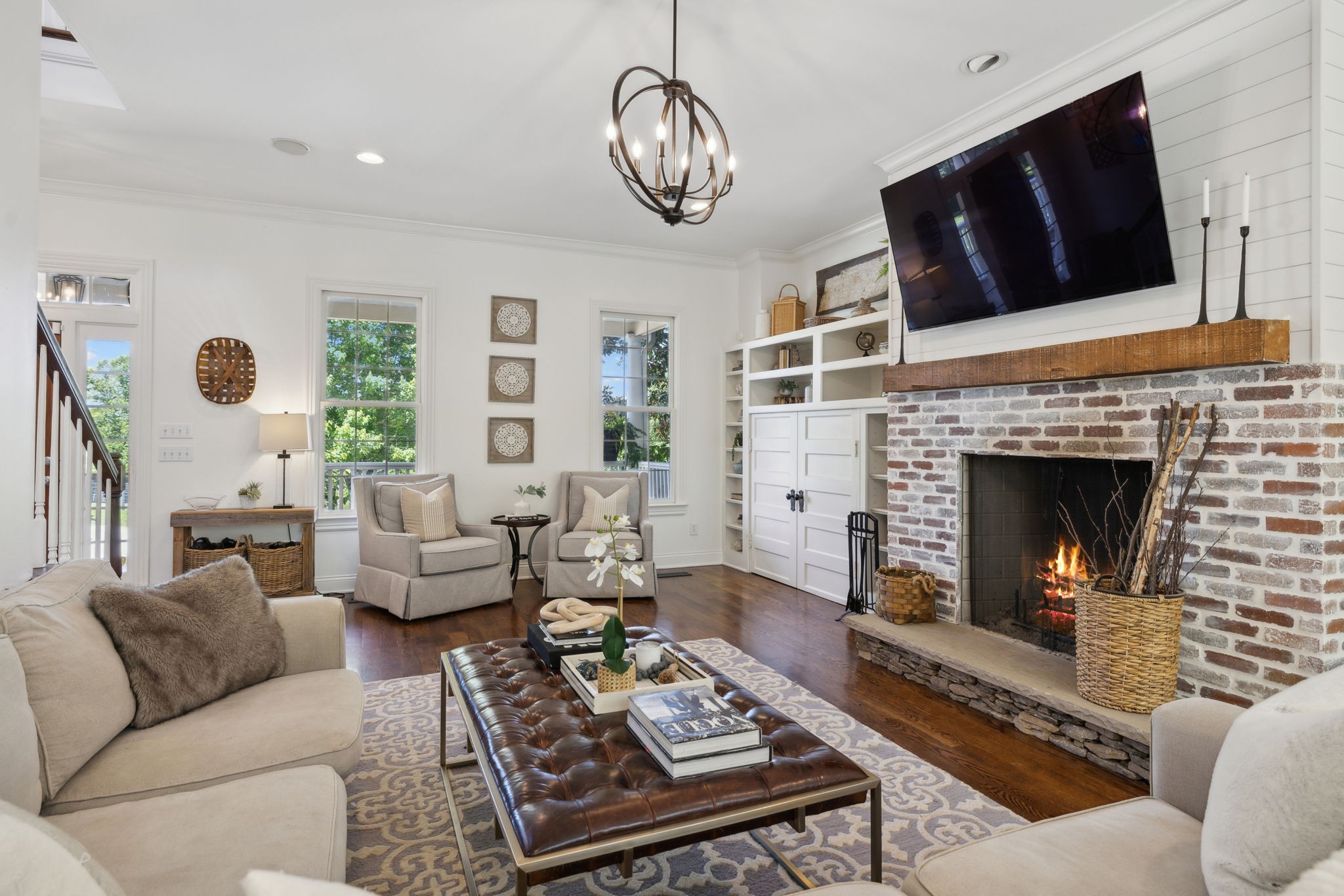 6795 Leipers Creek Road Columbia, TN 38401 - Photo 37 of 98 a living room with furniture a fireplace and a flat screen tv