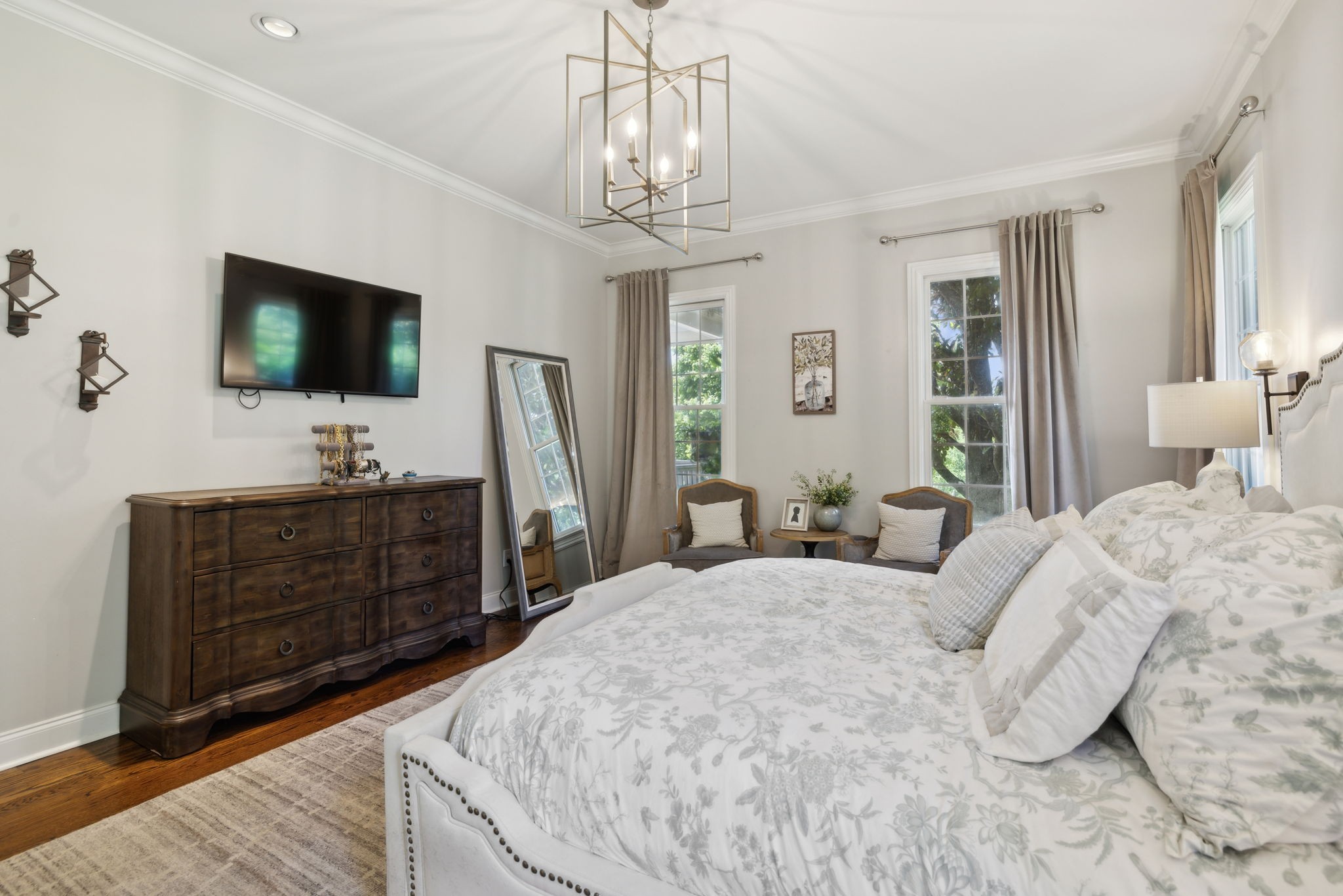 6795 Leipers Creek Road Columbia, TN 38401 - Photo 63 of 98 a spacious bedroom with a bed and a flat screen tv