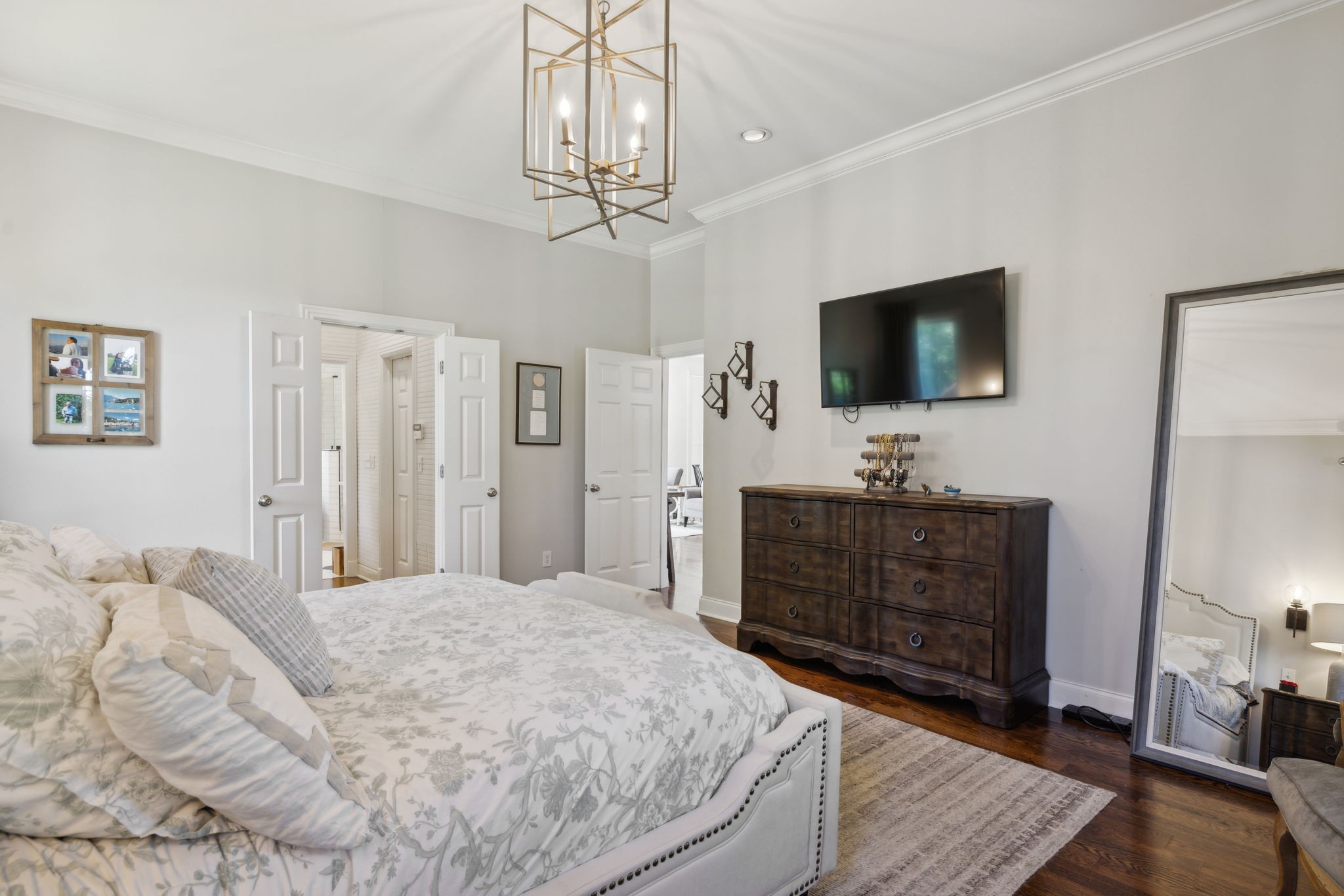 6795 Leipers Creek Road Columbia, TN 38401 - Photo 65 of 98 a bedroom with a bed and a flat screen tv