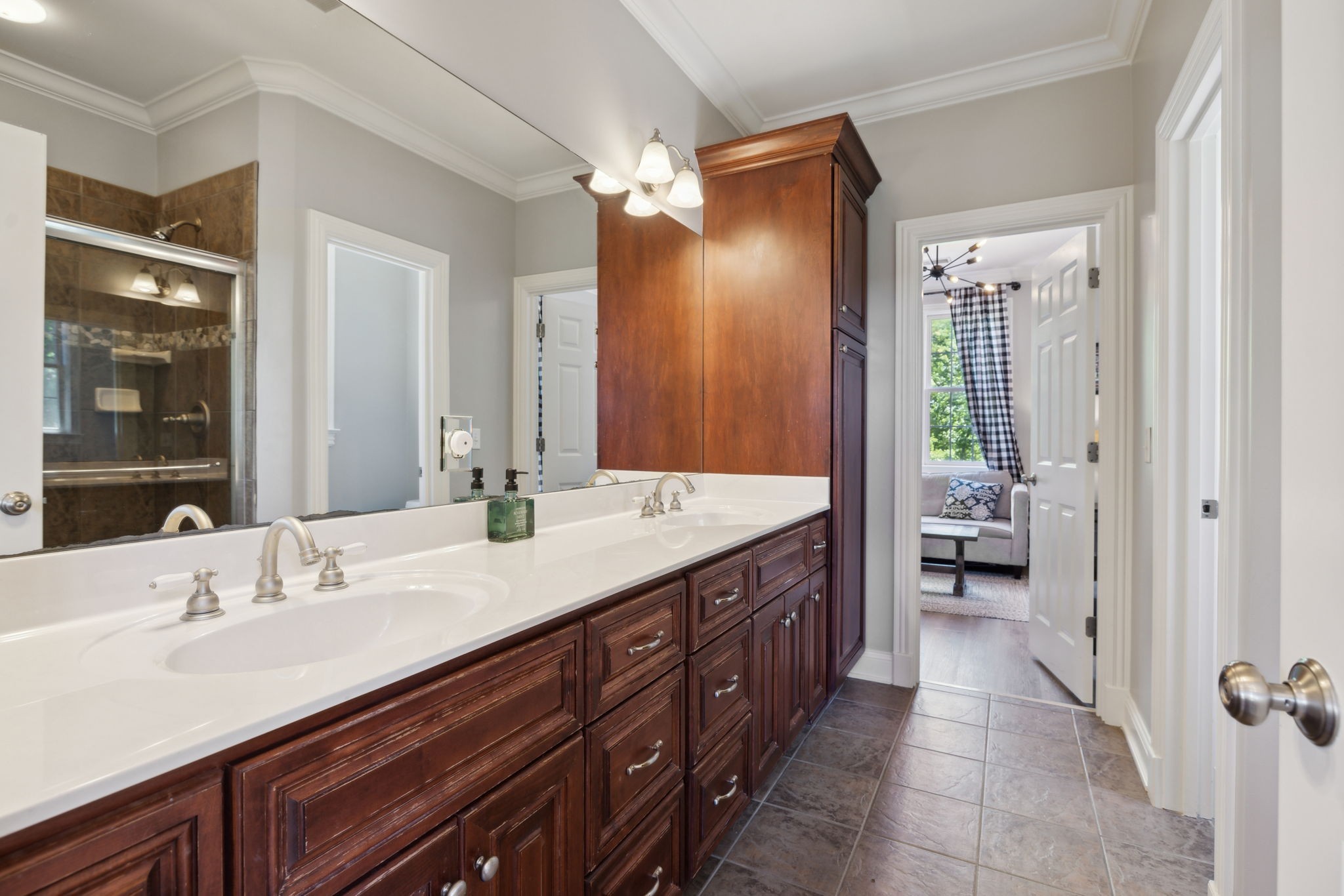 6795 Leipers Creek Road Columbia, TN 38401 - Photo 80 of 98 a spacious en suite bathroom with a double vanity sink and mirror