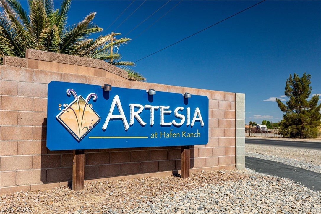 6720 Stubblefield Drive Pahrump, NV 89061 - Photo 40 of 51 A welcoming sign marks the entrance to the charming Artesia at Hafen Ranch community.