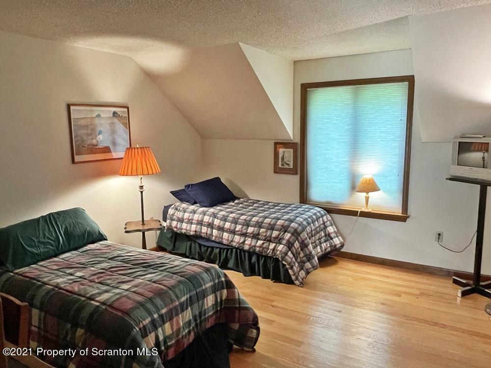 2480 Madisonville Road Moscow, PA 18444 - Photo 17 of 22 a bedroom with two beds and a window