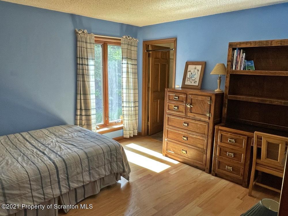 2480 Madisonville Road Moscow, PA 18444 - Photo 18 of 22 a bedroom with a bed and a dresser