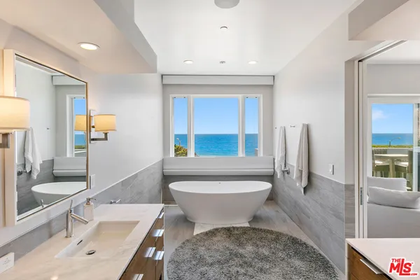 a bathroom with a sink and a window