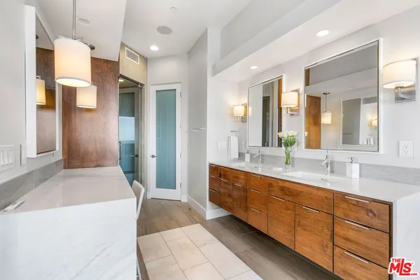 a bathroom with a shower and a tub