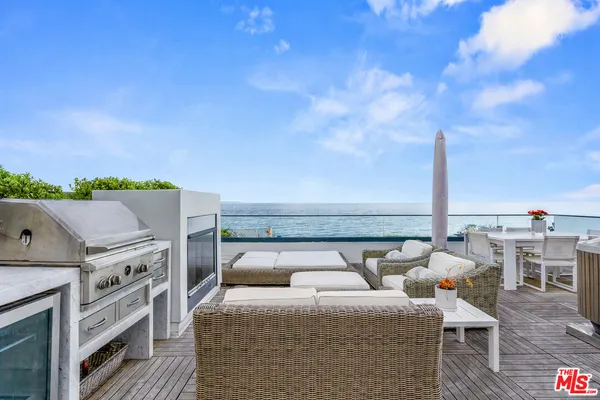 a balcony with furniture and city view