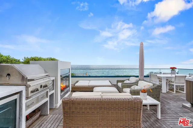a balcony with furniture and city view