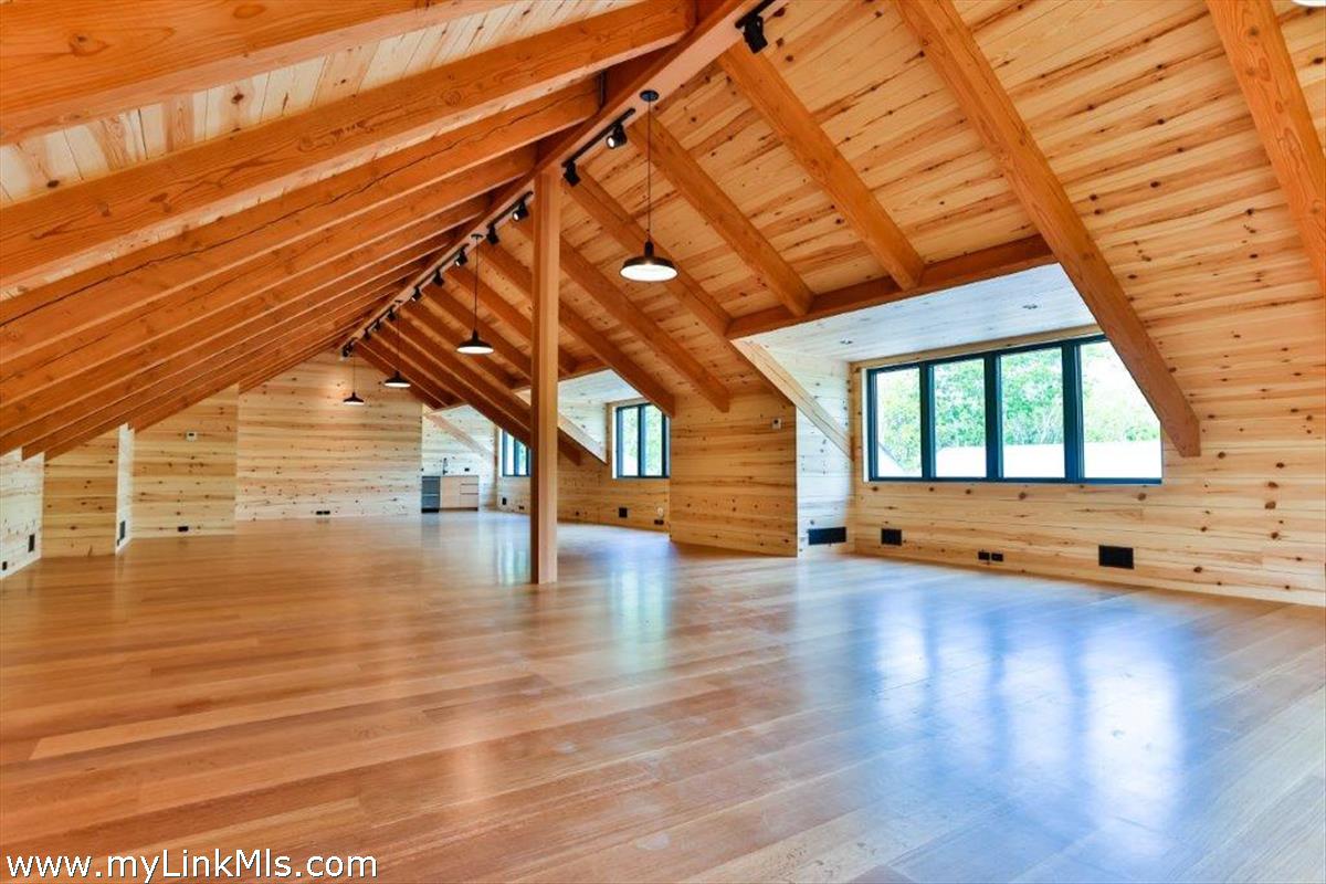4 Jacob's Neck Road Edgartown, MA 02539 - Photo 15 of 20 a view of an empty room with wooden floor and a window