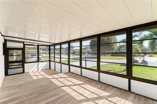 a view of spacious bedroom with a large window