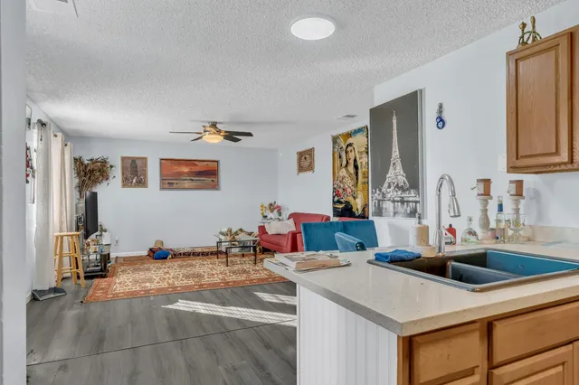 a kitchen with a sink and a refrigerator