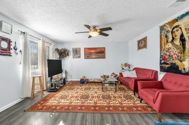 a living room with furniture or couch and a flat screen tv