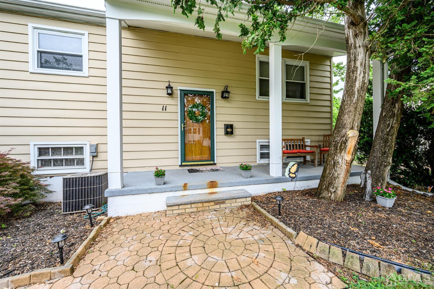 11 Atlantic Road Somerset, NJ 08873 - Photo 2 of 35 a view of a backyard with a large tree
