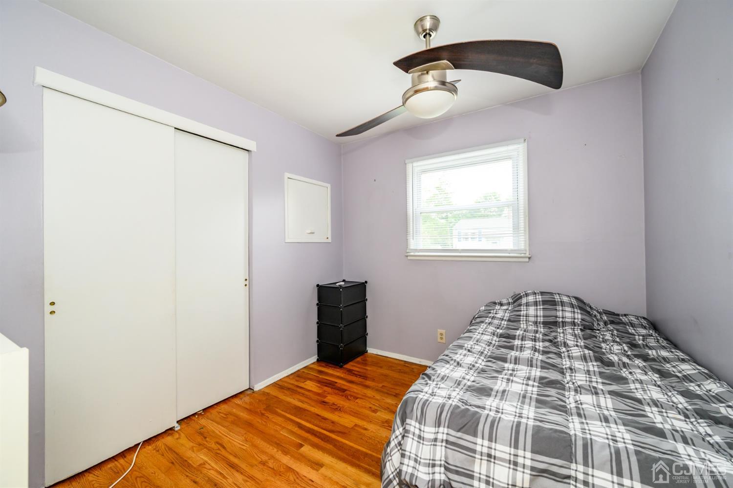 11 Atlantic Road Somerset, NJ 08873 - Photo 12 of 35 a bedroom with a bed and a window