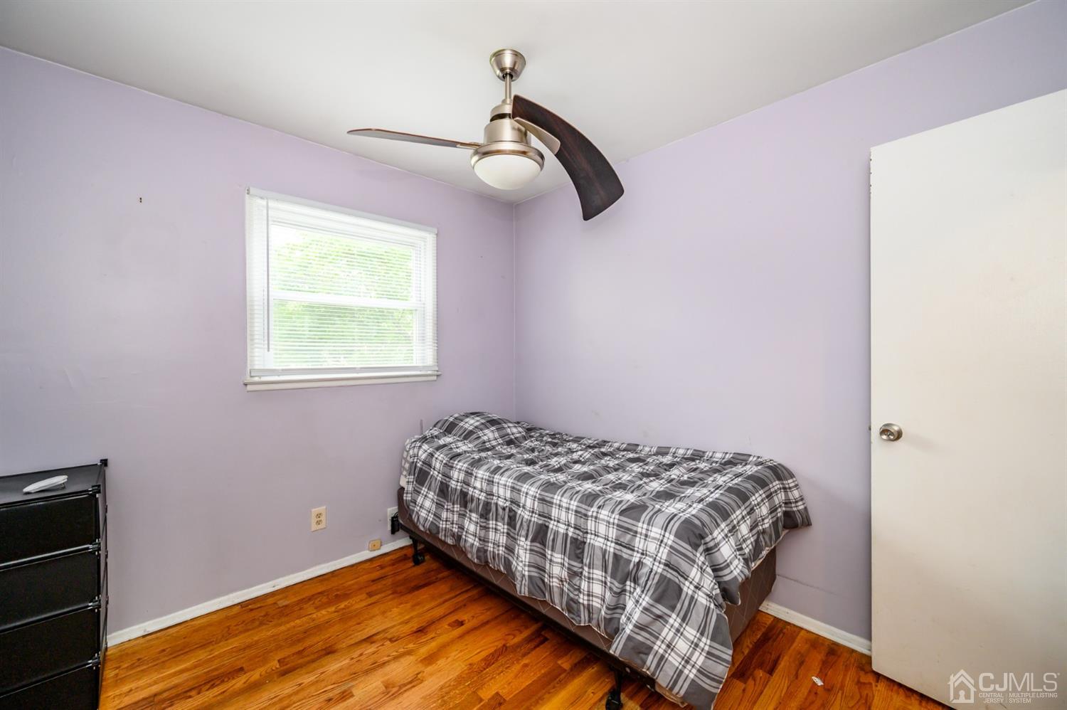 11 Atlantic Road Somerset, NJ 08873 - Photo 13 of 35 a bedroom with a bed and a window
