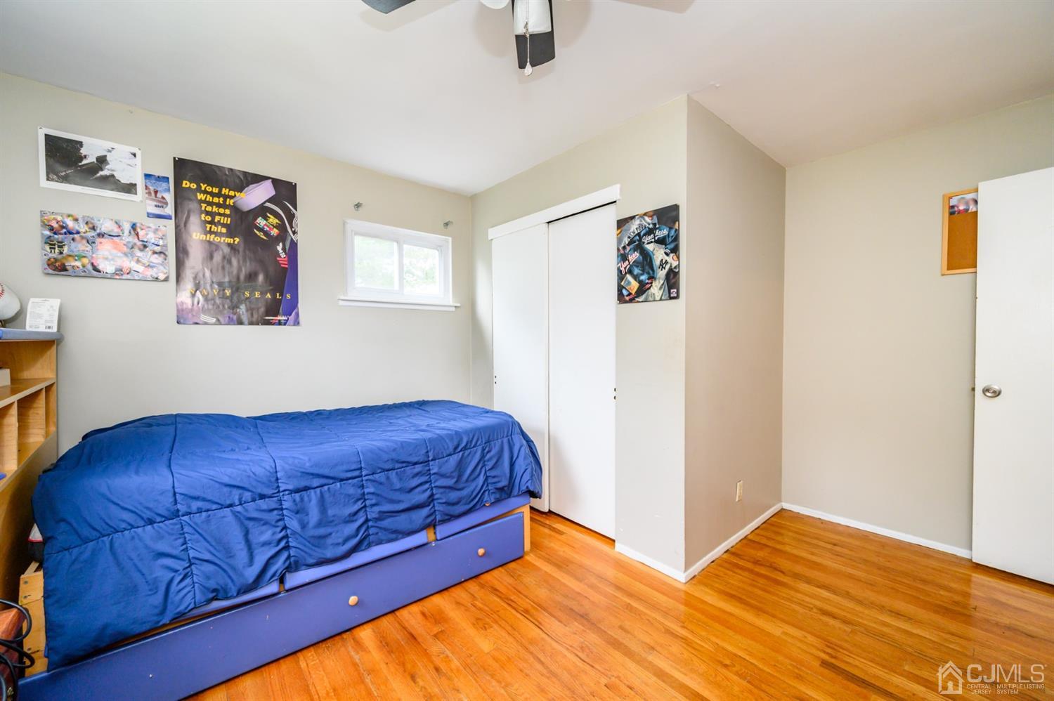 11 Atlantic Road Somerset, NJ 08873 - Photo 16 of 35 a bed room with a bed and painting on the wall