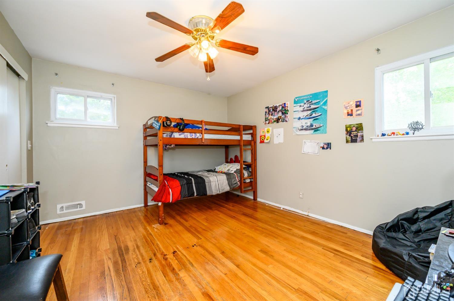 11 Atlantic Road Somerset, NJ 08873 - Photo 18 of 35 a bedroom with a bed and a walk in closet