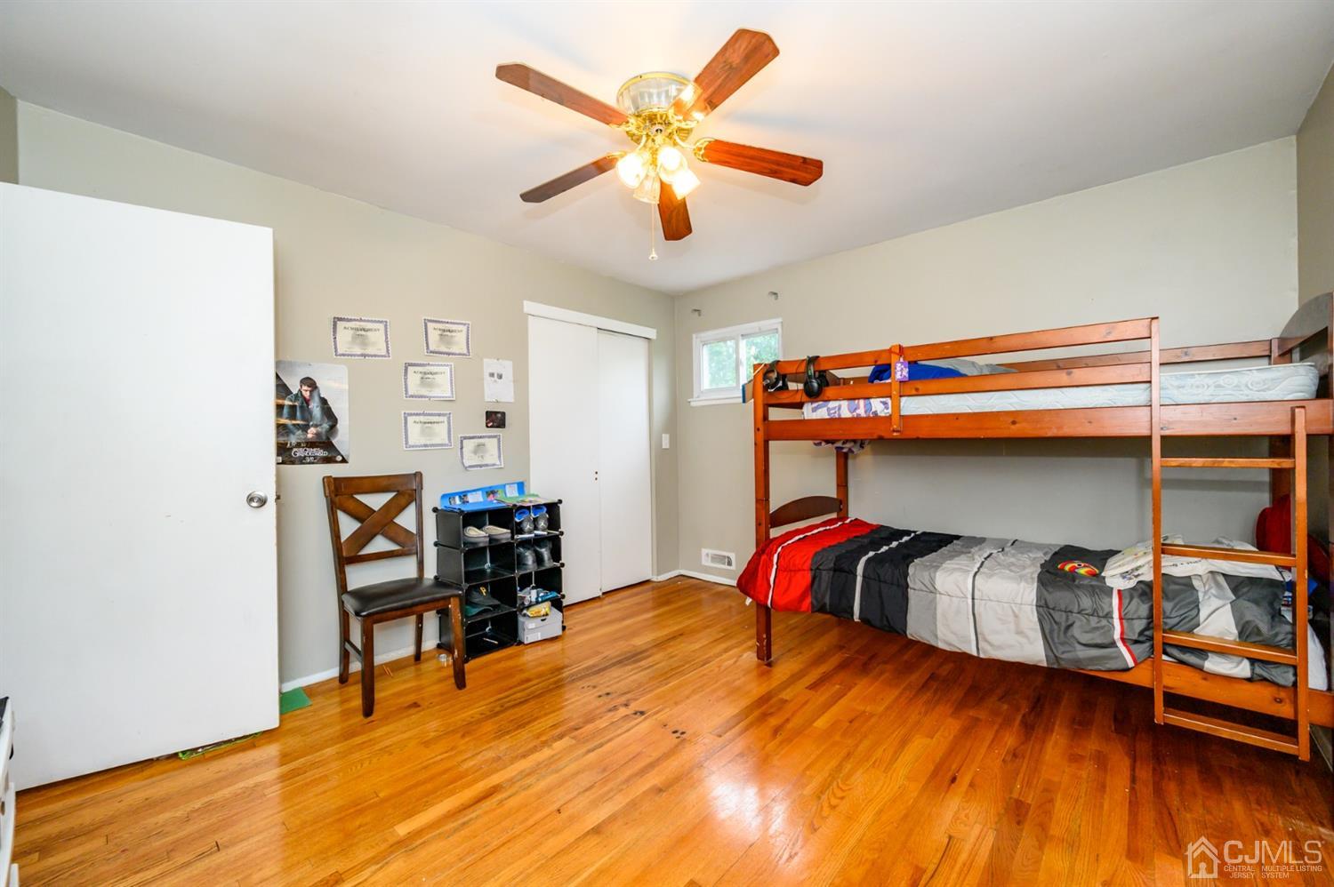 11 Atlantic Road Somerset, NJ 08873 - Photo 20 of 35 a bedroom with a bed and wooden floor