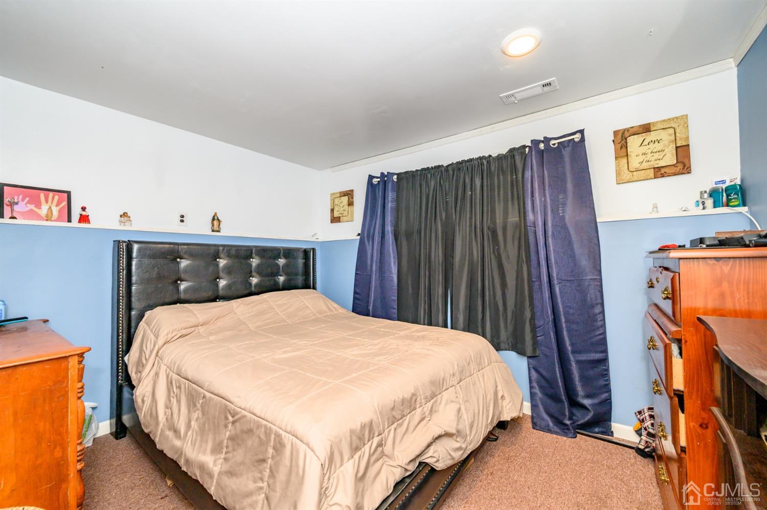 11 Atlantic Road Somerset, NJ 08873 - Photo 26 of 35 a bedroom with a bed and a tv