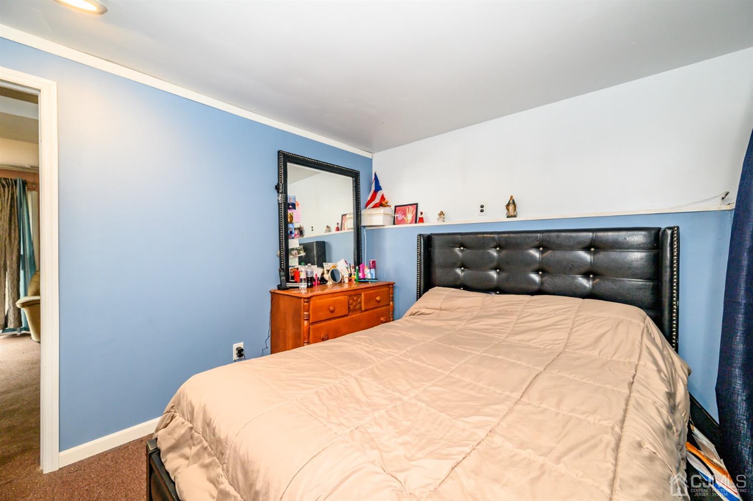 11 Atlantic Road Somerset, NJ 08873 - Photo 27 of 35 a bedroom with a bed and wooden floor