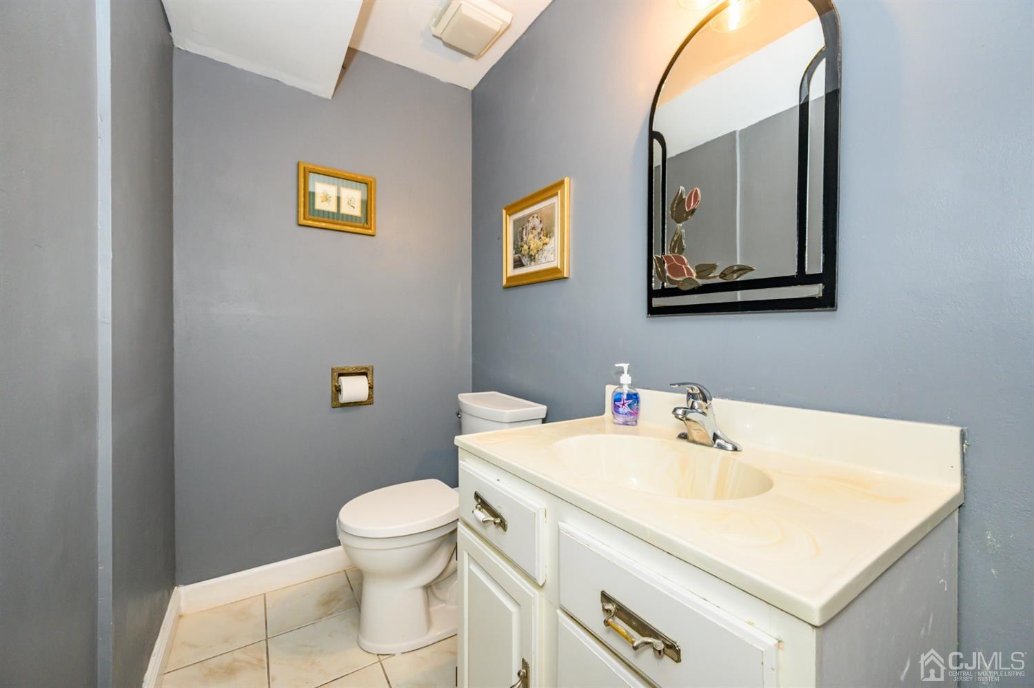 11 Atlantic Road Somerset, NJ 08873 - Photo 29 of 35 a bathroom with a sink and a toilet