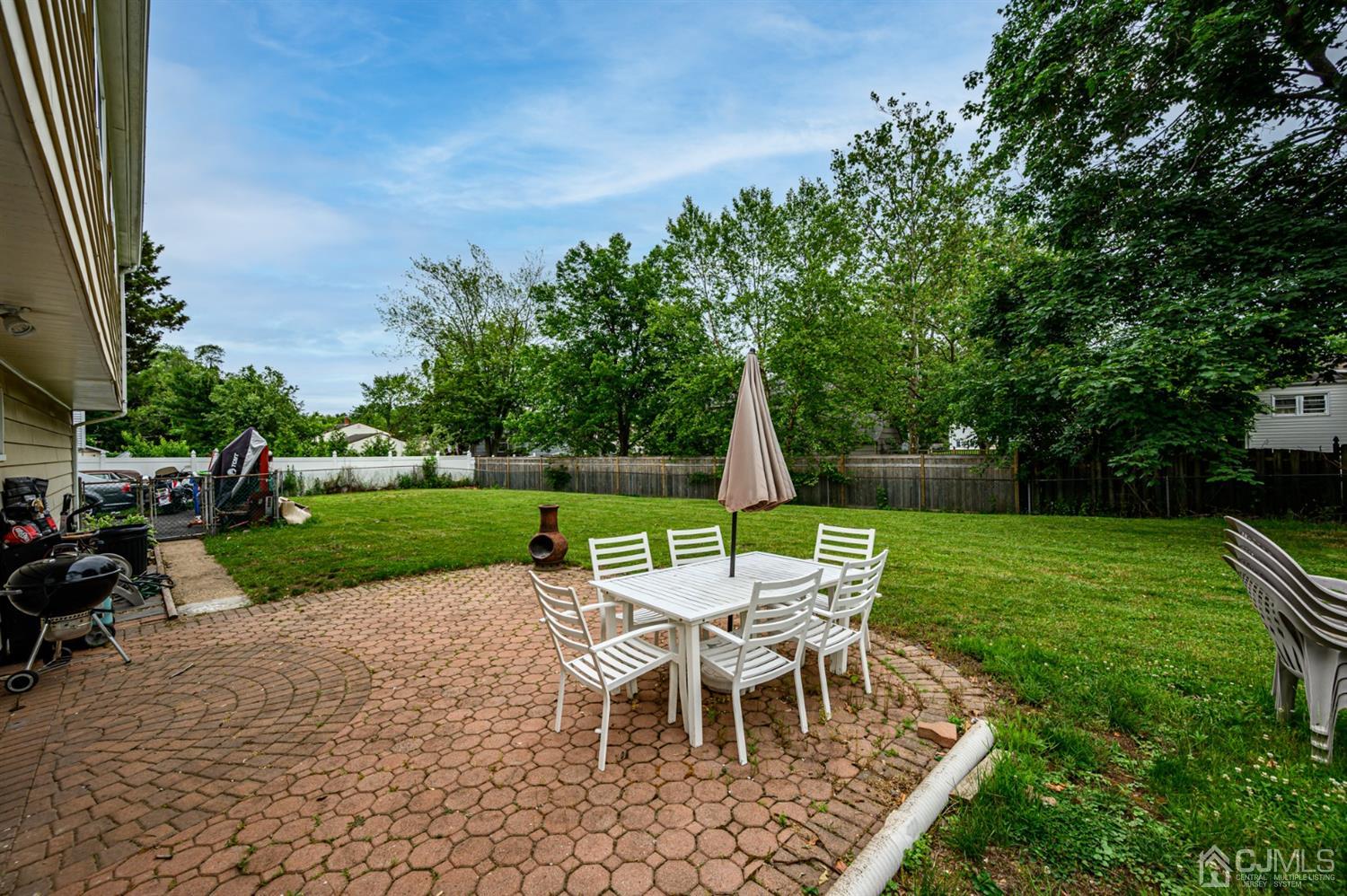 11 Atlantic Road Somerset, NJ 08873 - Photo 30 of 35 a view of a dining room with furniture and garden