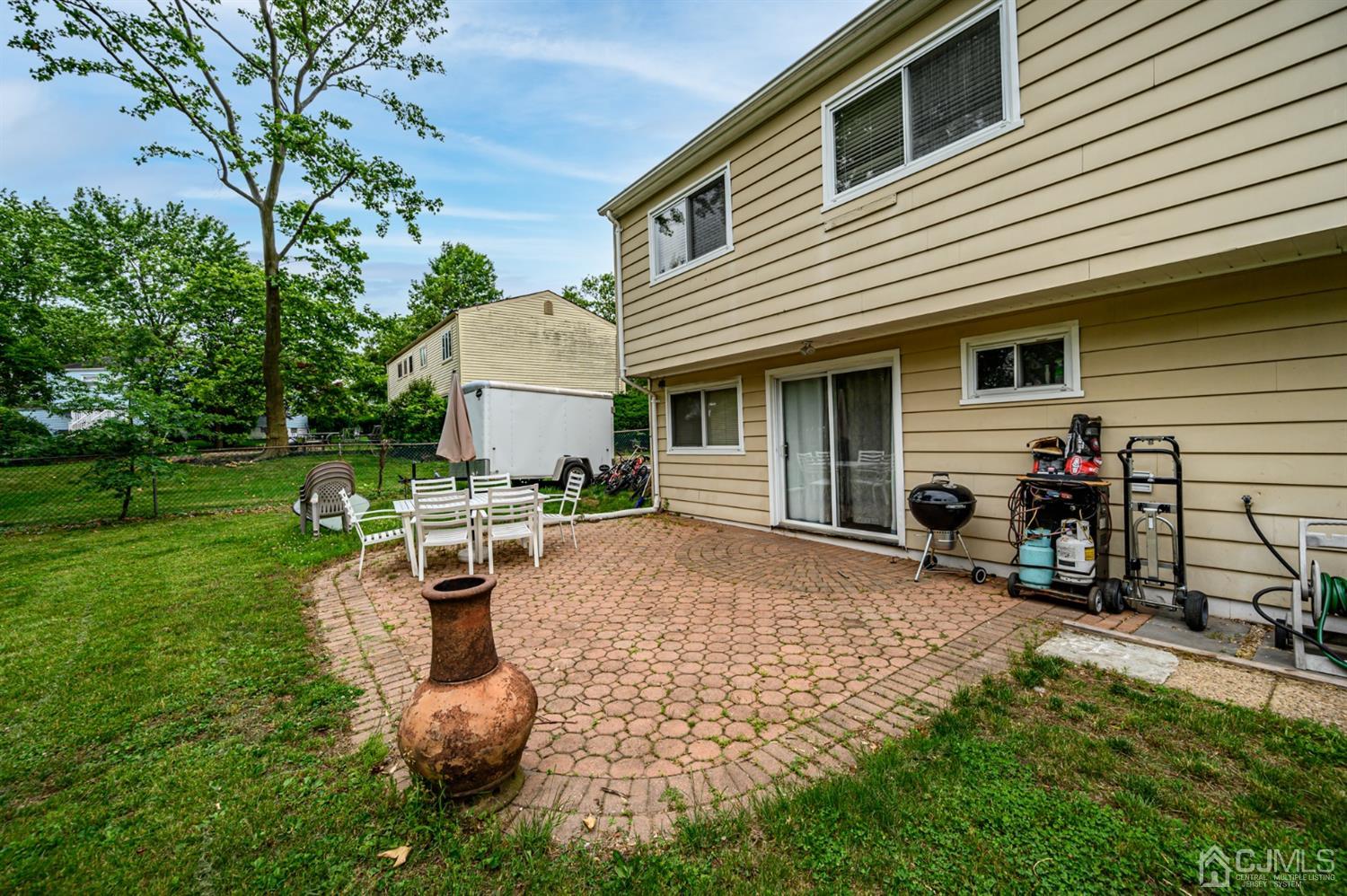 11 Atlantic Road Somerset, NJ 08873 - Photo 31 of 35 a view of a house with backyard sitting area and garden