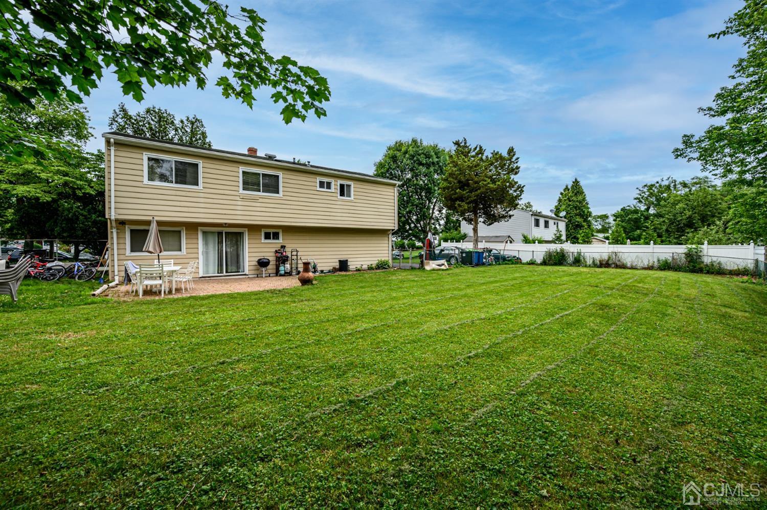 11 Atlantic Road Somerset, NJ 08873 - Photo 32 of 35 a front view of a house with a yard and trees