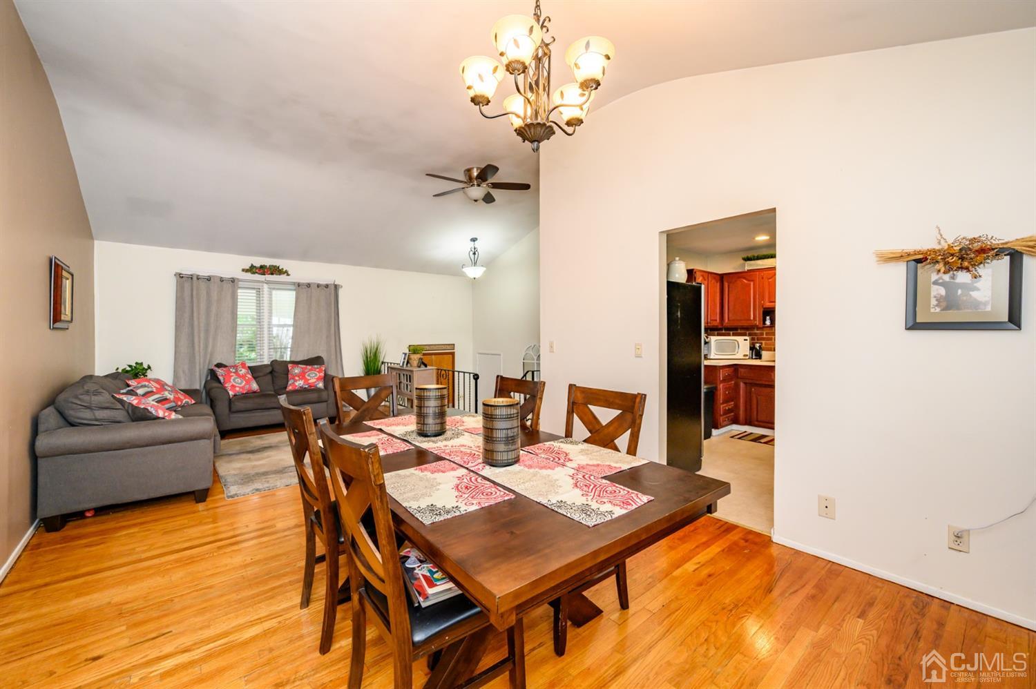 11 Atlantic Road Somerset, NJ 08873 - Photo 7 of 35 a view of a dining room with furniture and a chandelier