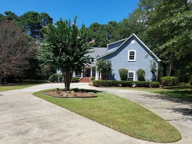 722 Bass Road Macon, GA 31210 - Photo 2 of 40 a front view of a house with a yard