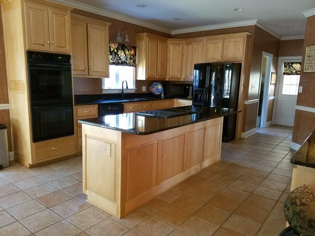 722 Bass Road Macon, GA 31210 - Photo 11 of 40 a kitchen with stainless steel appliances granite countertop a refrigerator and a stove