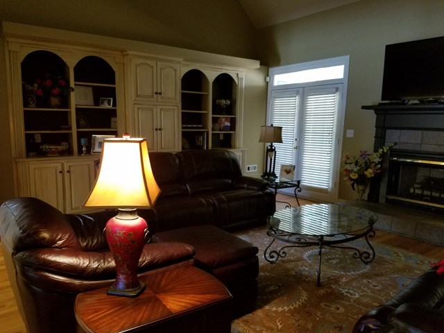 722 Bass Road Macon, GA 31210 - Photo 16 of 40 a living room with furniture fireplace and flat screen tv