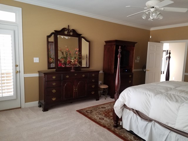 722 Bass Road Macon, GA 31210 - Photo 19 of 40 a bedroom with a bed and a dresser