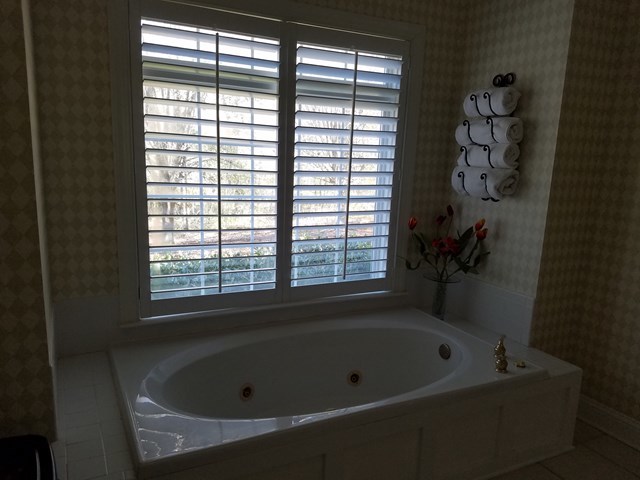 722 Bass Road Macon, GA 31210 - Photo 22 of 40 a bathroom with a bathtub and a window