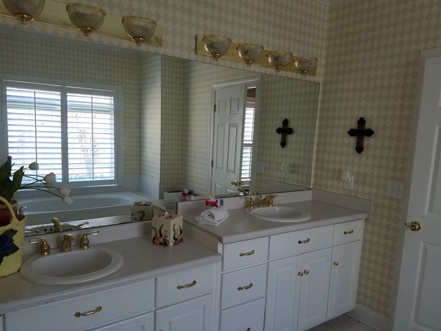722 Bass Road Macon, GA 31210 - Photo 24 of 40 a bathroom with double sink and a mirror