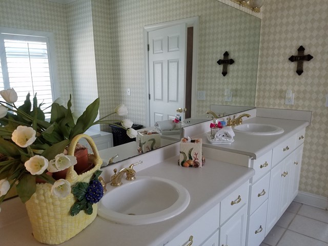 722 Bass Road Macon, GA 31210 - Photo 26 of 40 a bathroom with a sink double vanity and a mirror