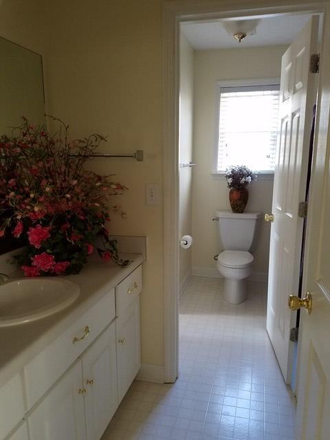 722 Bass Road Macon, GA 31210 - Photo 29 of 40 a view of a bathroom with a shower and a toilet