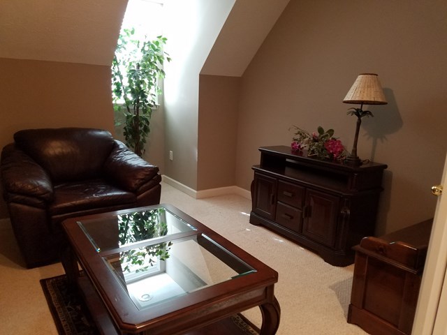 722 Bass Road Macon, GA 31210 - Photo 32 of 40 a living room with furniture and a potted plant