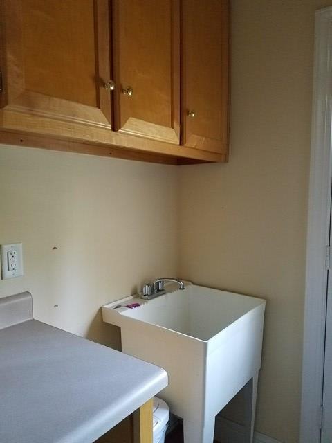722 Bass Road Macon, GA 31210 - Photo 9 of 40 a bathroom with a sink and cabinets
