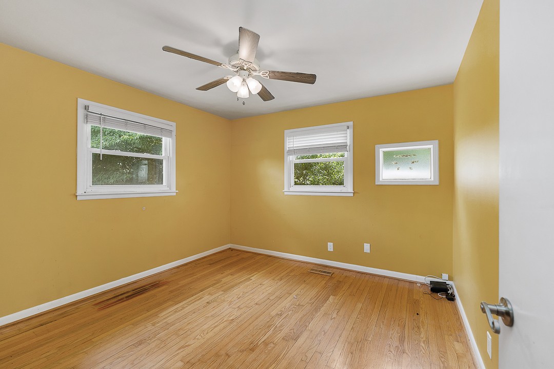 1823 Evins Mill Road Smithville, TN 37166 - Photo 13 of 19 a view of a room with wooden floor and a ceiling fan
