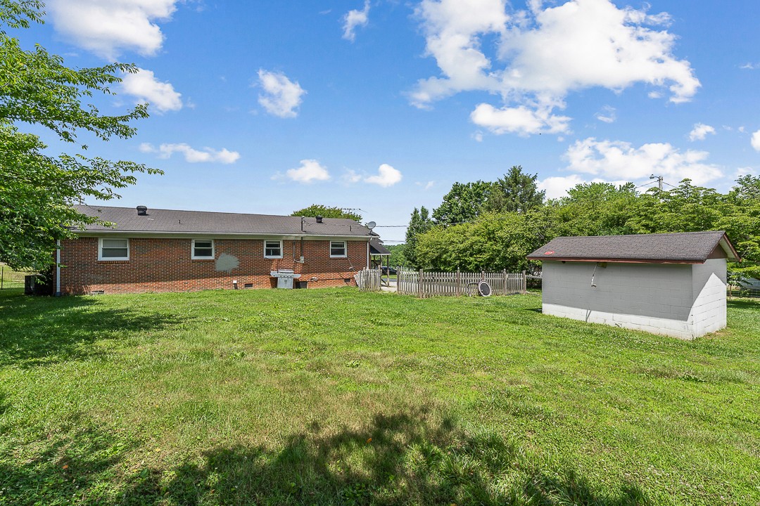 1823 Evins Mill Road Smithville, TN 37166 - Photo 17 of 19 a front view of a house with garden
