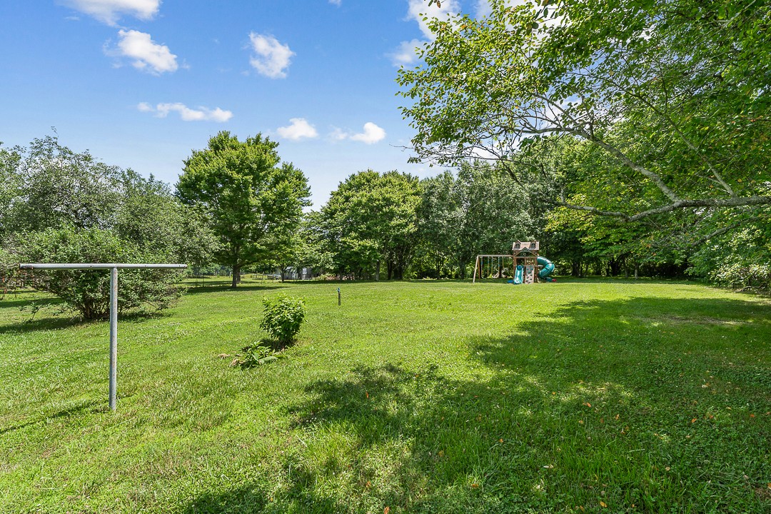 1823 Evins Mill Road Smithville, TN 37166 - Photo 18 of 19 a view of yard with grass and trees