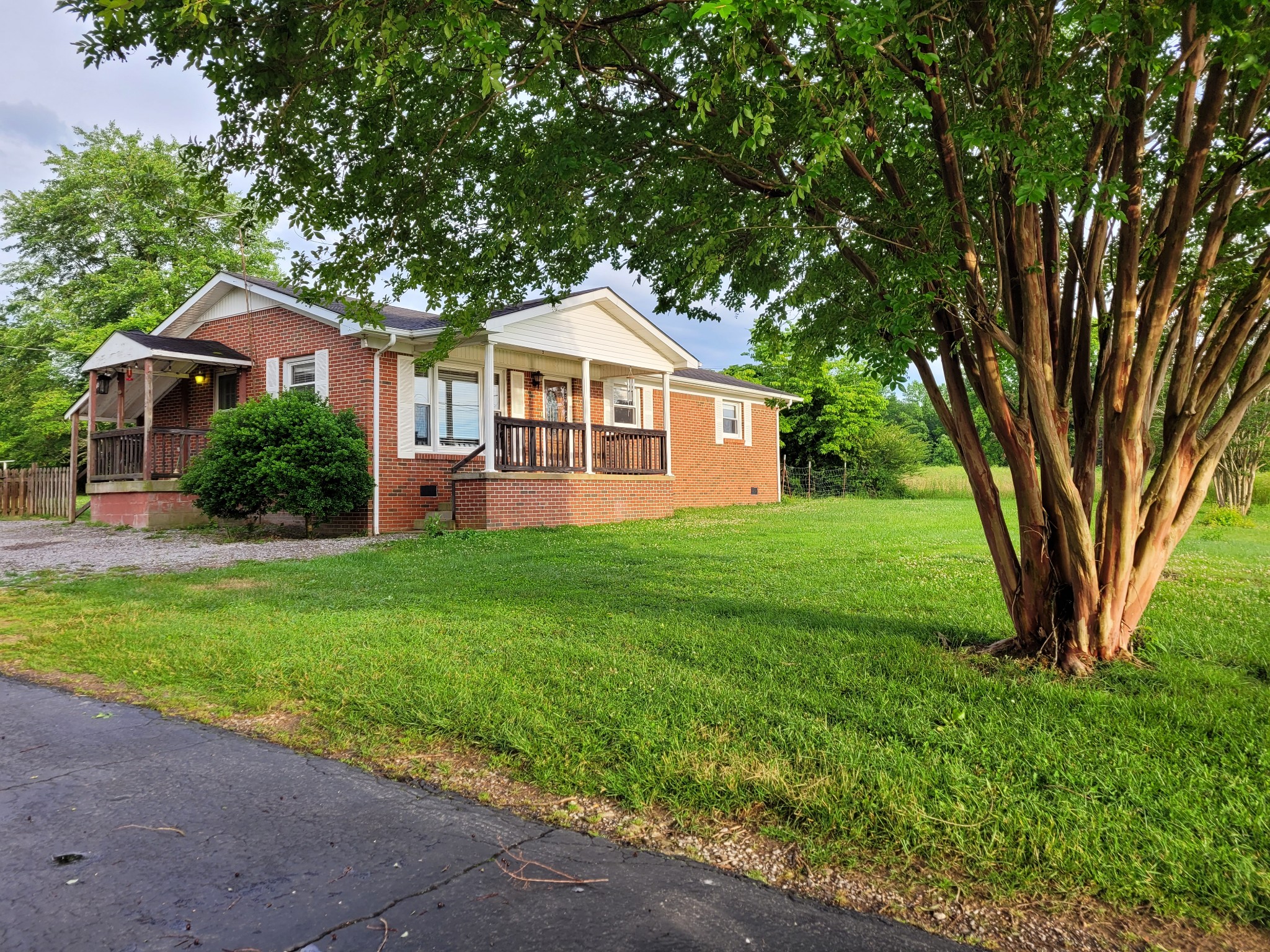 1823 Evins Mill Road Smithville, TN 37166 - Photo 19 of 19 a front view of a house with a yard and trees