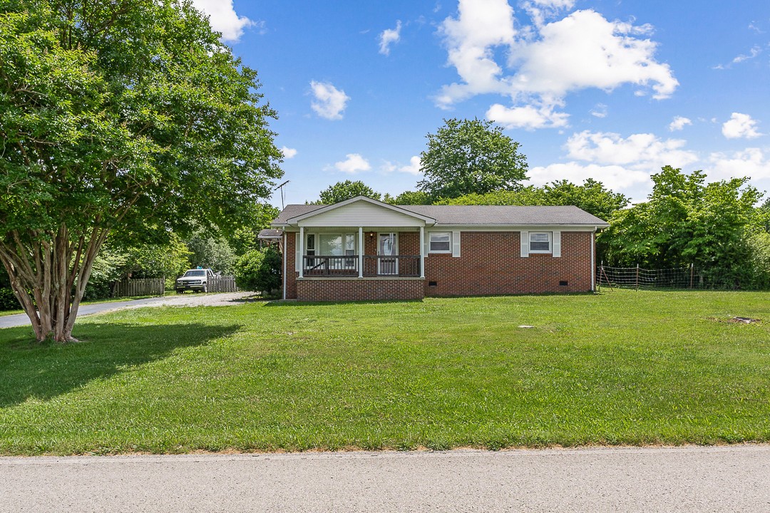 1823 Evins Mill Road Smithville, TN 37166 - Photo 2 of 19 a view of a house with a backyard