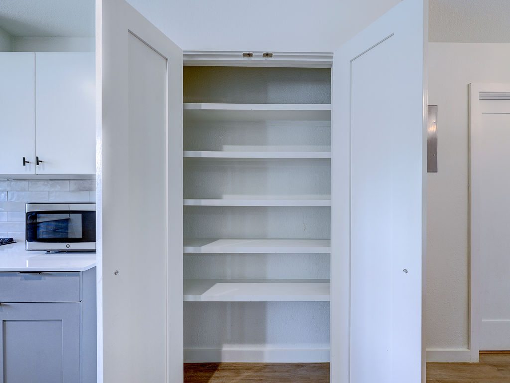 5842 Secrest Drive Austin, TX 78759 - Photo 15 of 40 A built-in pantry with ample shelving provides generous storage space.