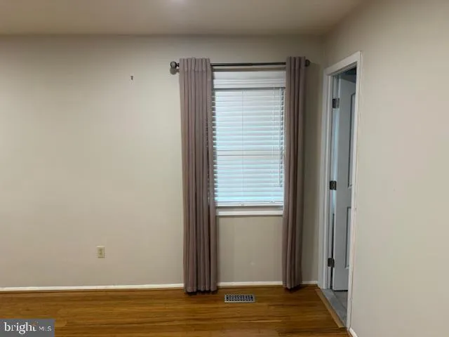 a bathroom with a shower and toilet