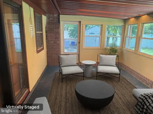 a view of backyard with a small cabin and a chair