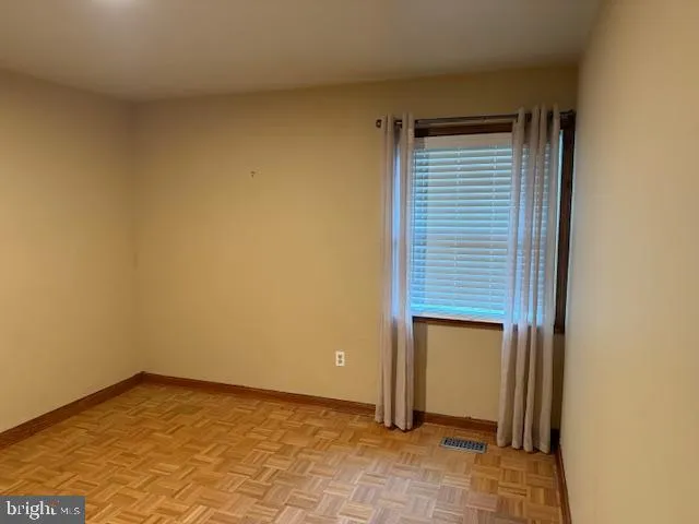 a view of a backyard with large trees