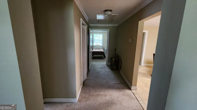 a view of a hallway with a white walls