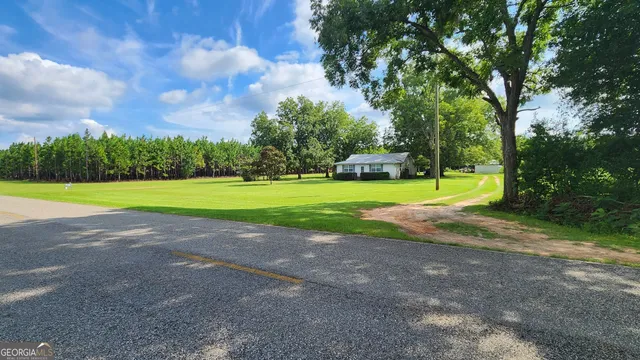 a view of a golf course with a lake