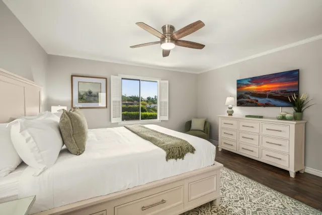 a bedroom with a bed and a dresser